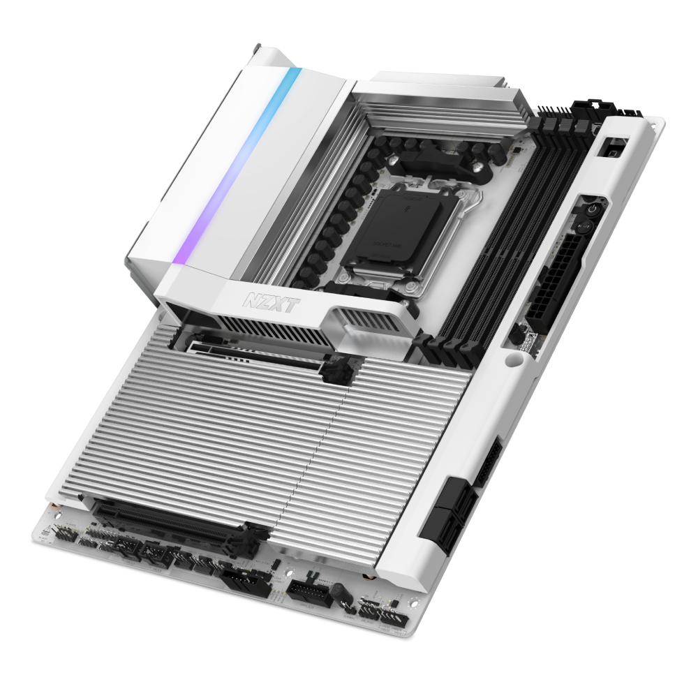 The NZXT N9 X870E motherboard features a modern white design with large silver heatsinks, black DDR5 RAM slots, and stylish RGB lighting accents.